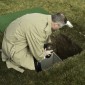 Greg placing urn